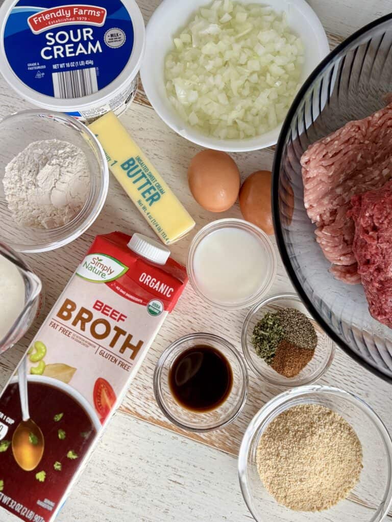 Ingredients for Swedish Meatballs and Sauce on a wooden board